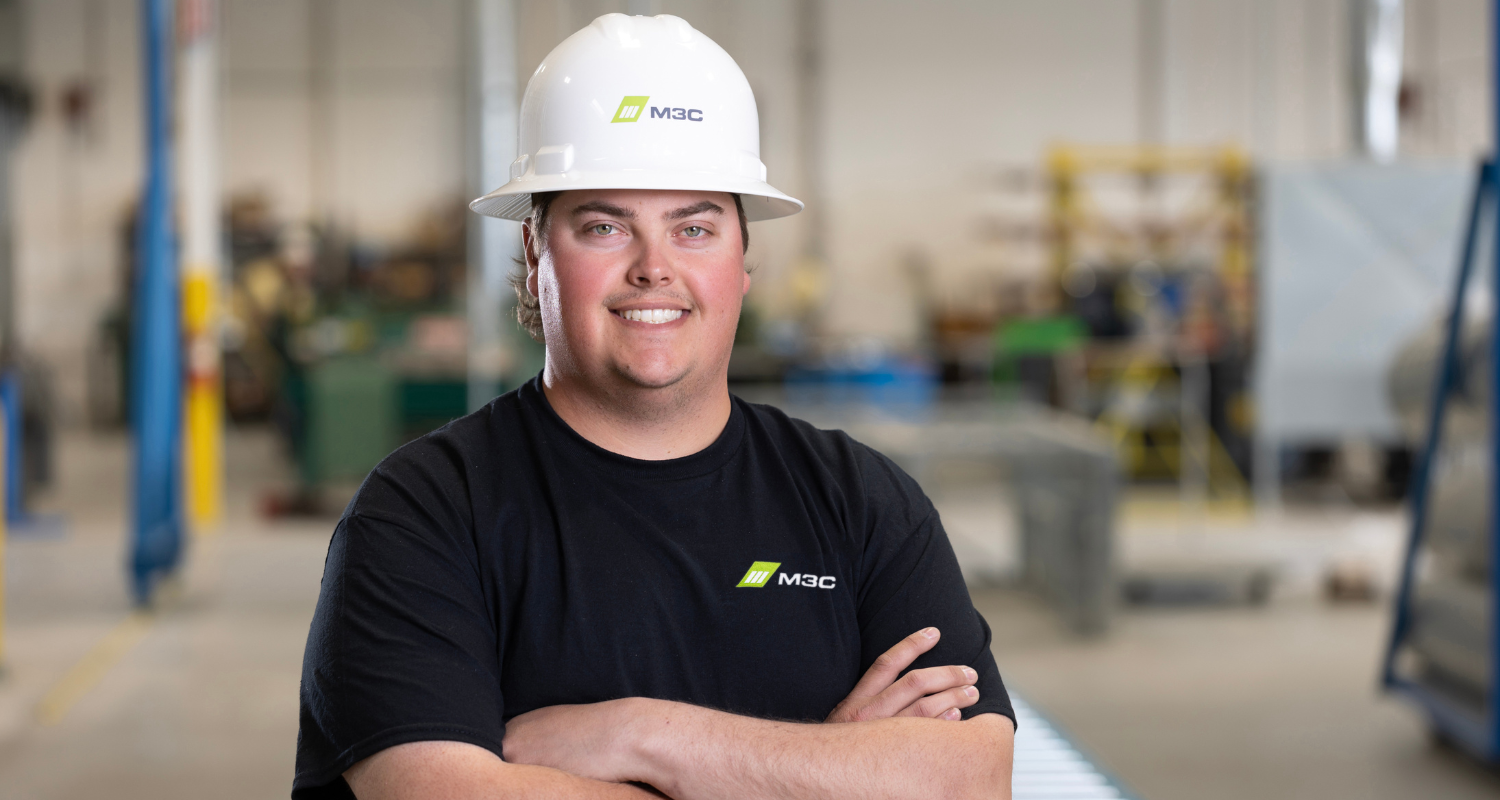 Headshot photo of Brandon Leslie in M3C's manufacturing facility.